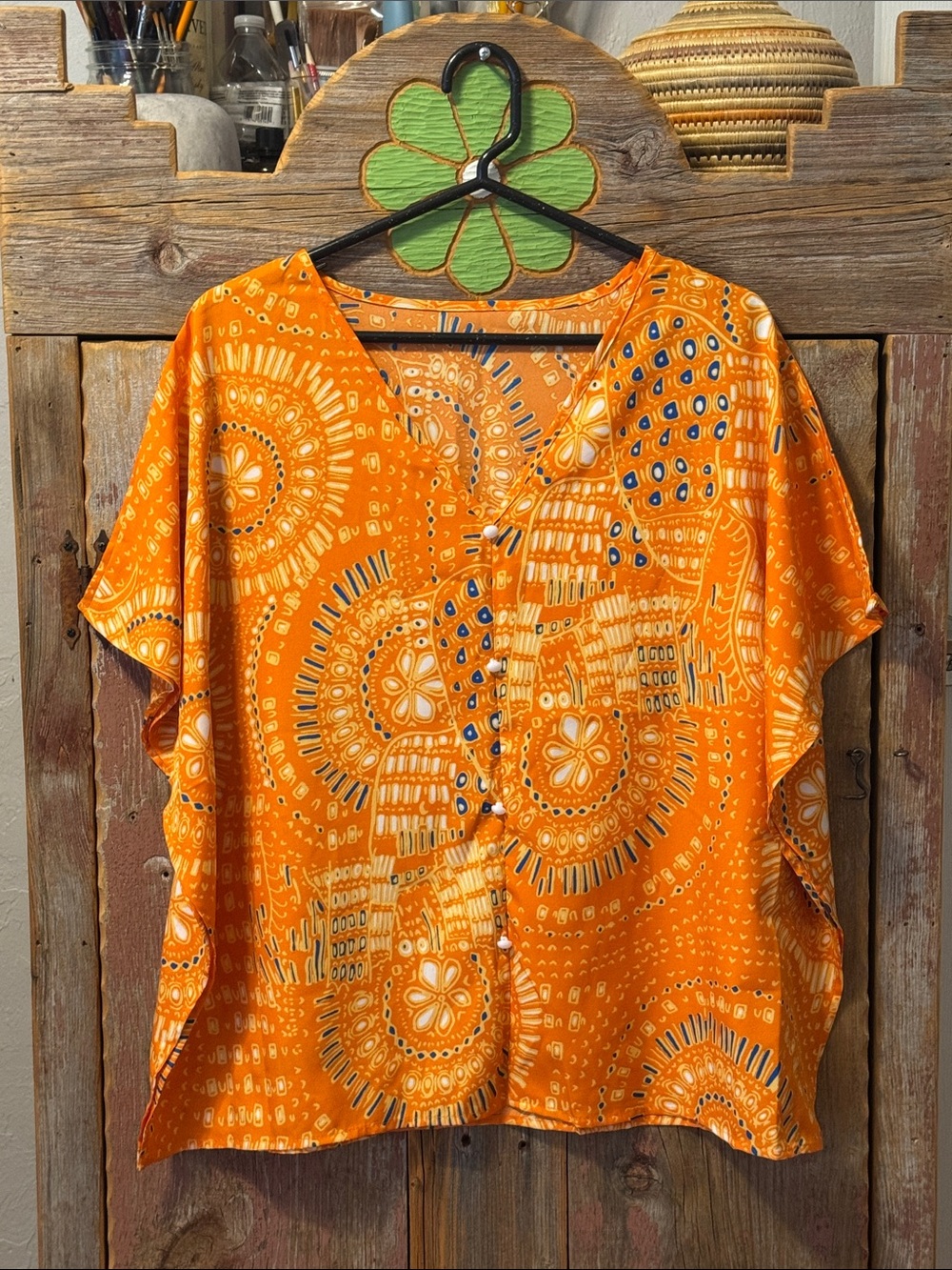 Women’s Orange Printed V-Neck Blouse. Flowy, size medium